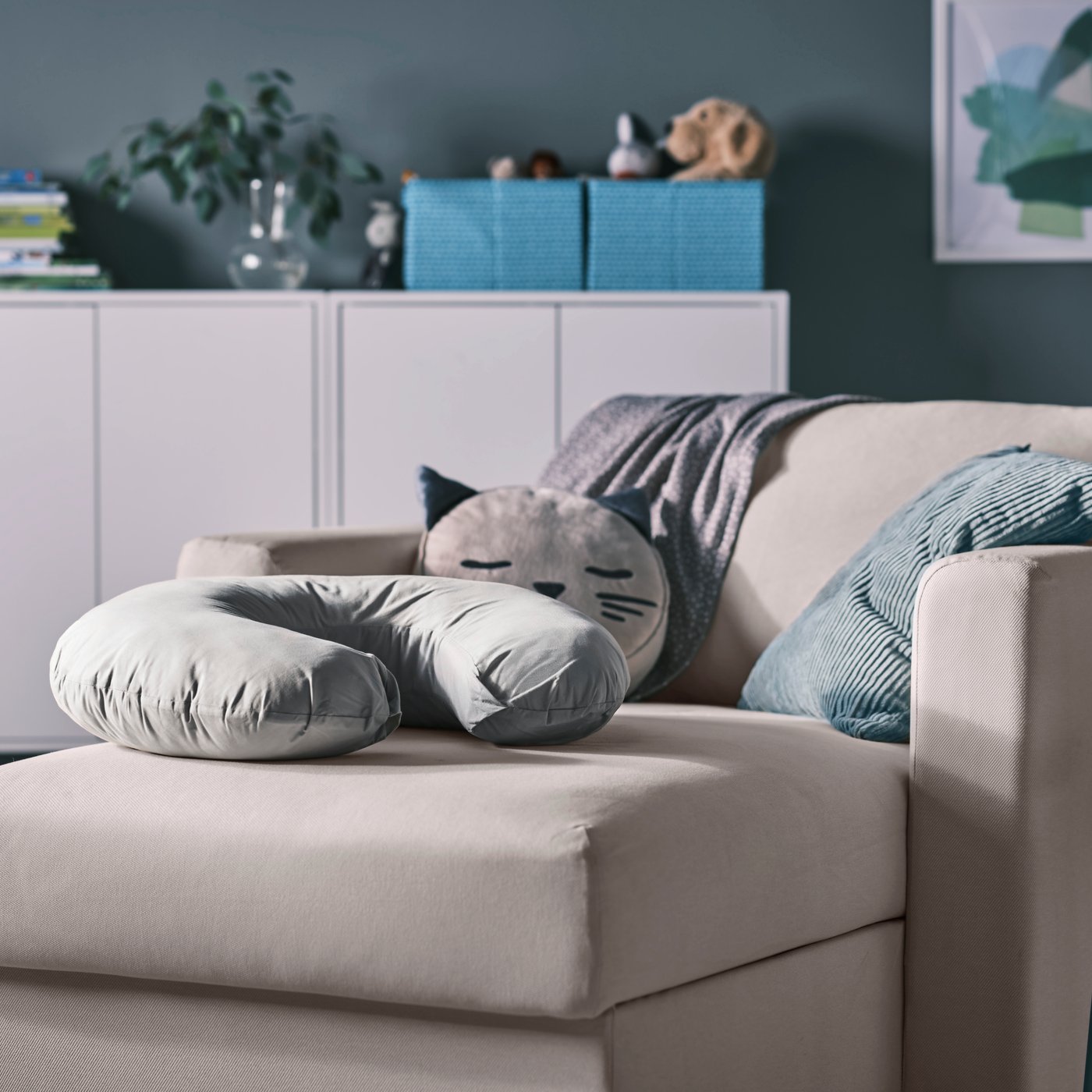 A grey LEN nursing pillow