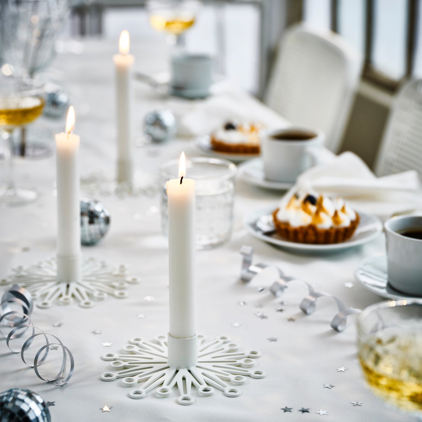 A white FRÖJDA candlestick