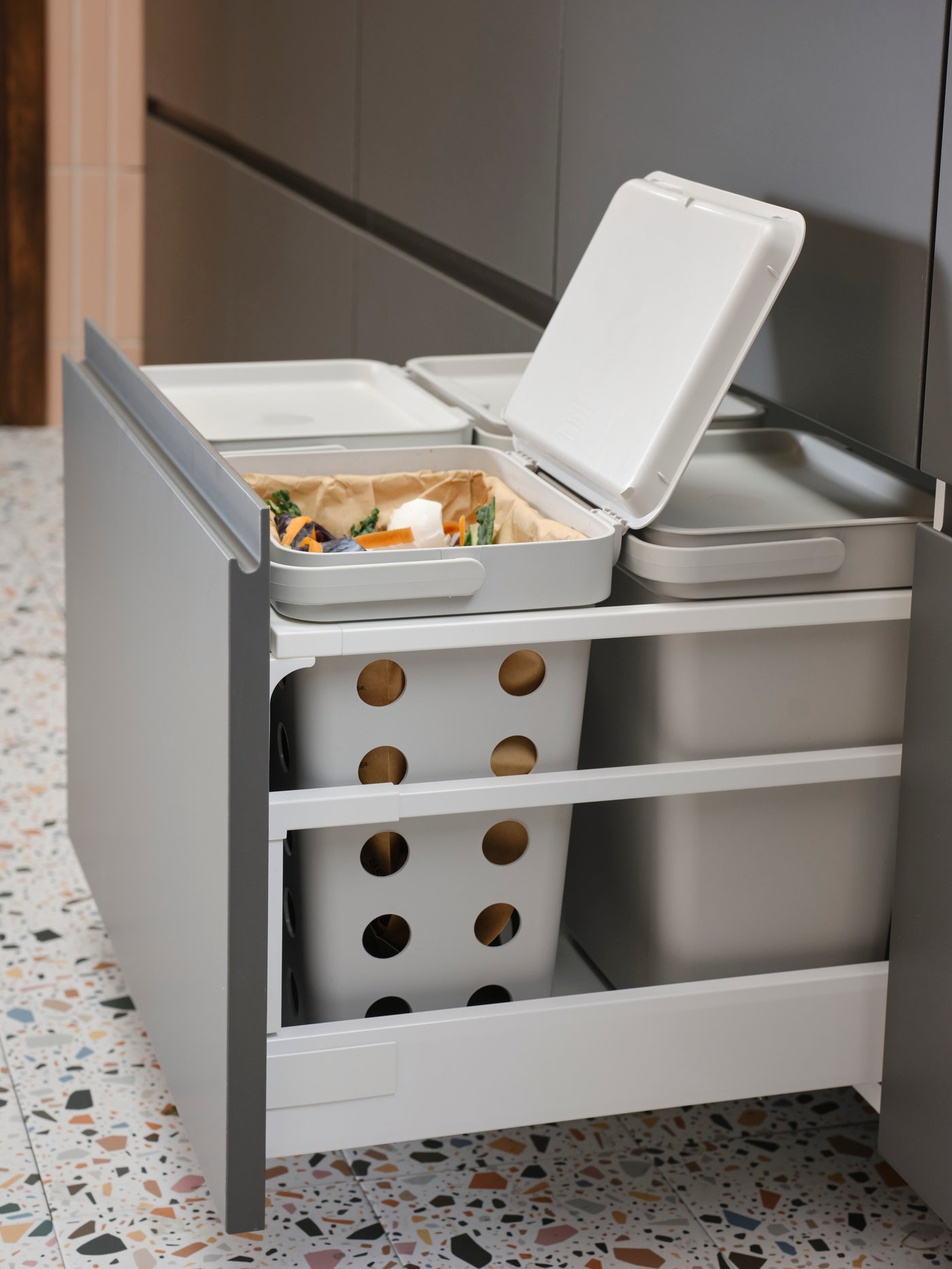 A dark grey VOXTORP drawer front