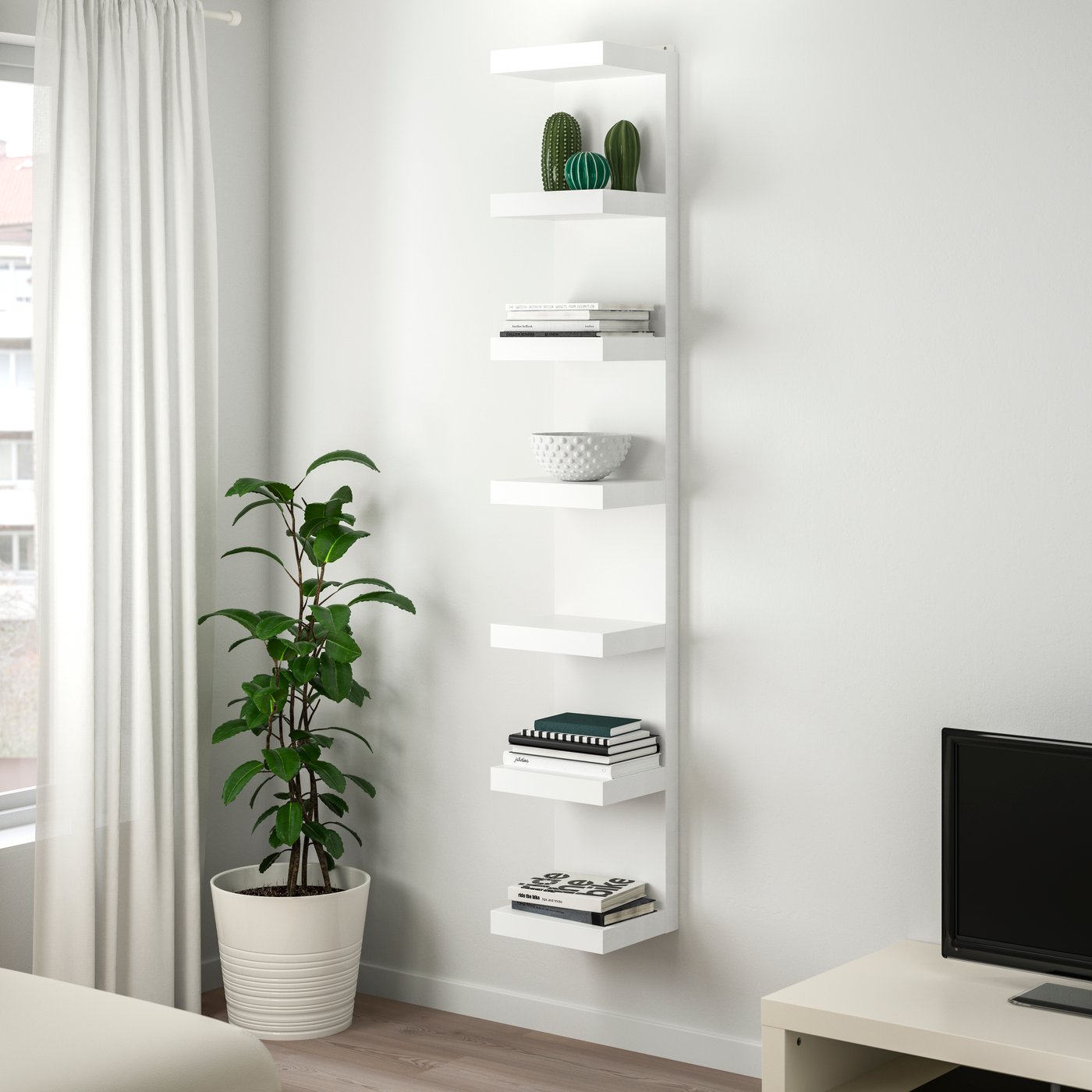 A white LACK wall shelf unit