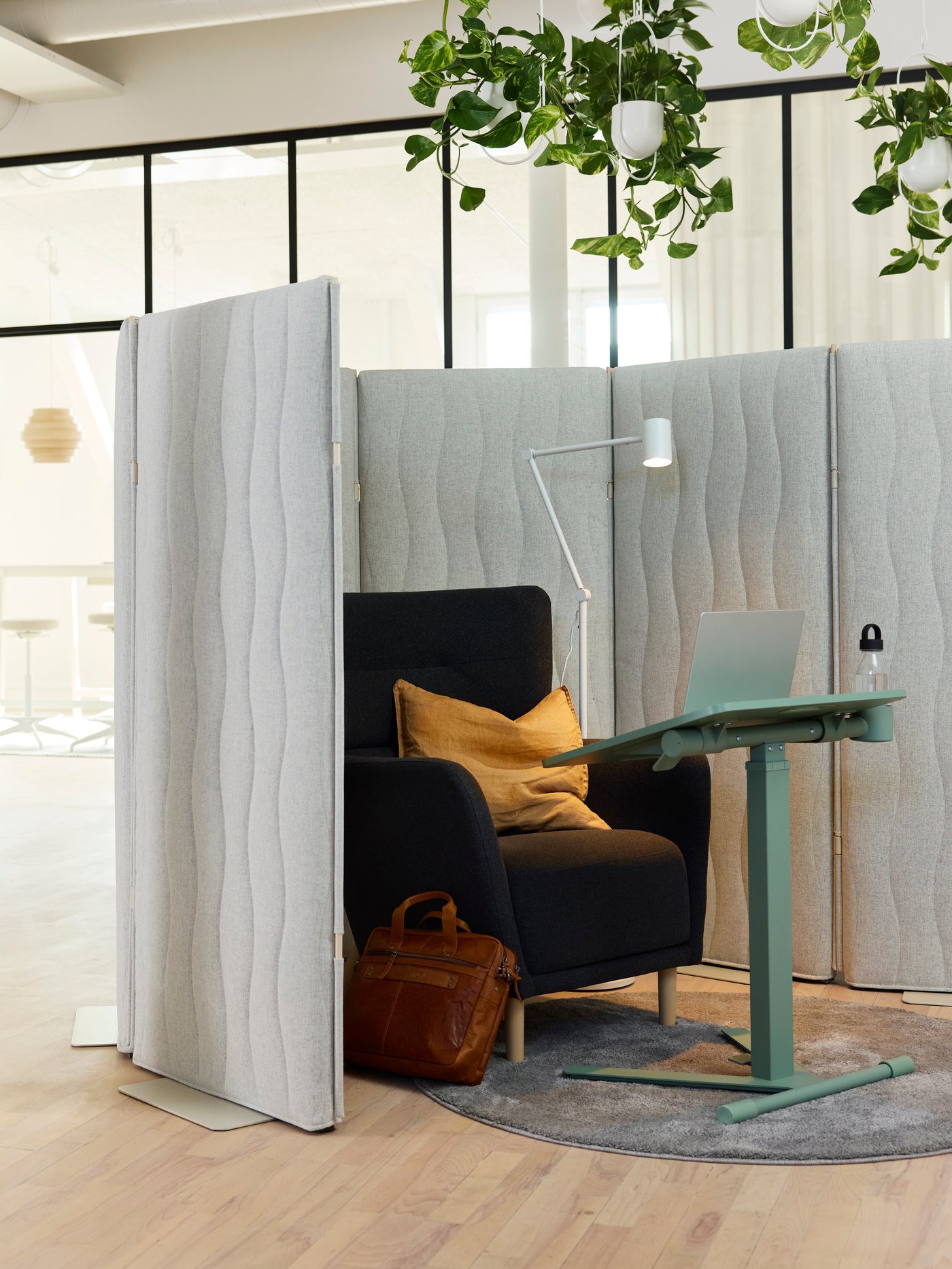 A white NYMÅNE floor/reading lamp in the home office