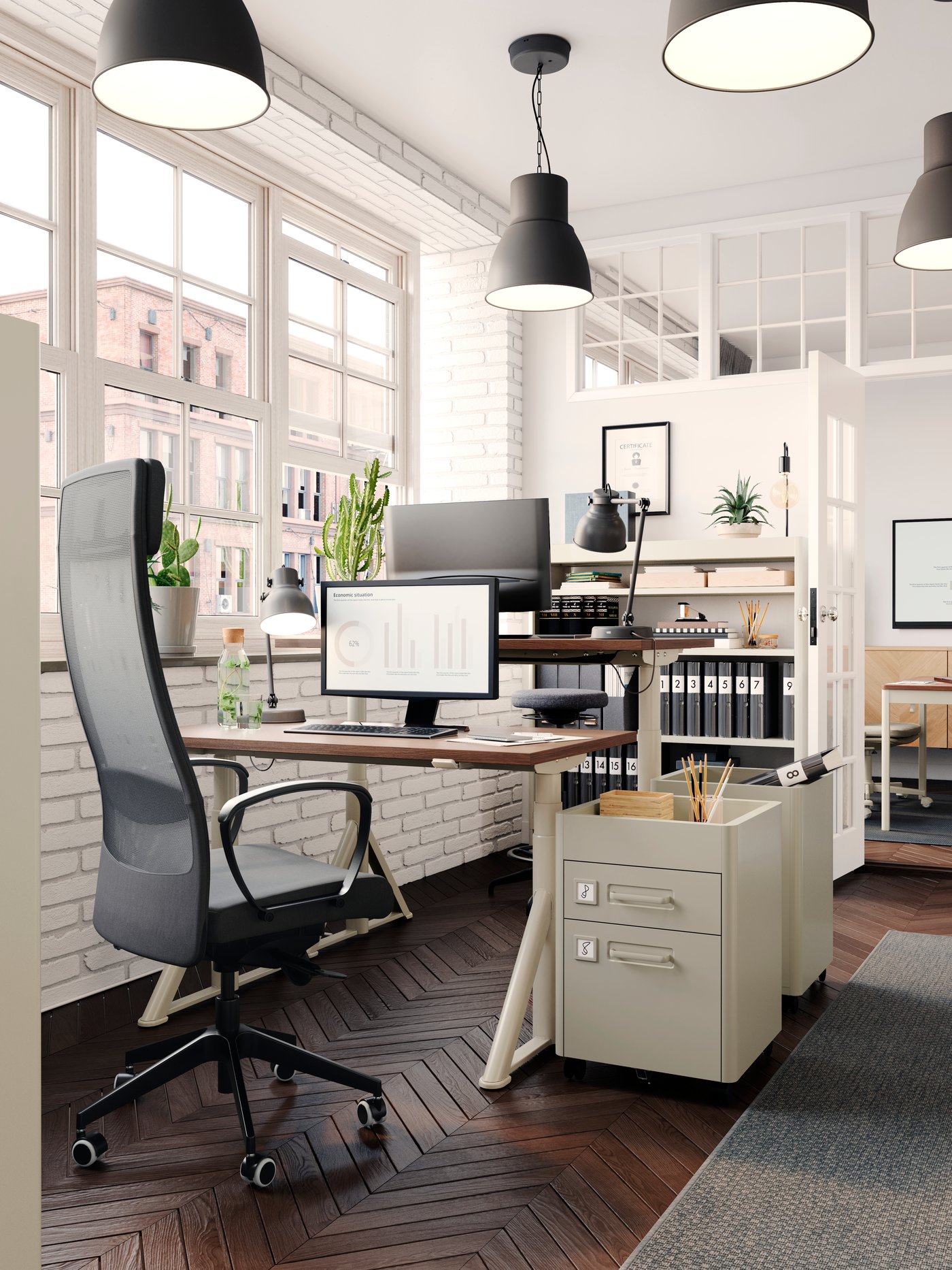 A MARKUS chair in front of a TROTTEN office desk and a drawer unit, pictured in a small office environment.