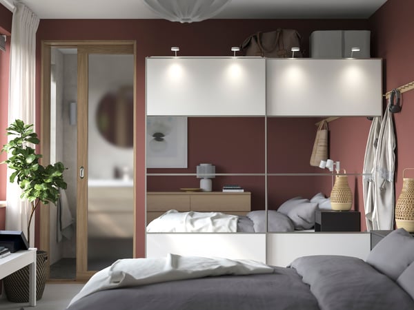A white double sided/white mirror glass PAX wardrobe combination