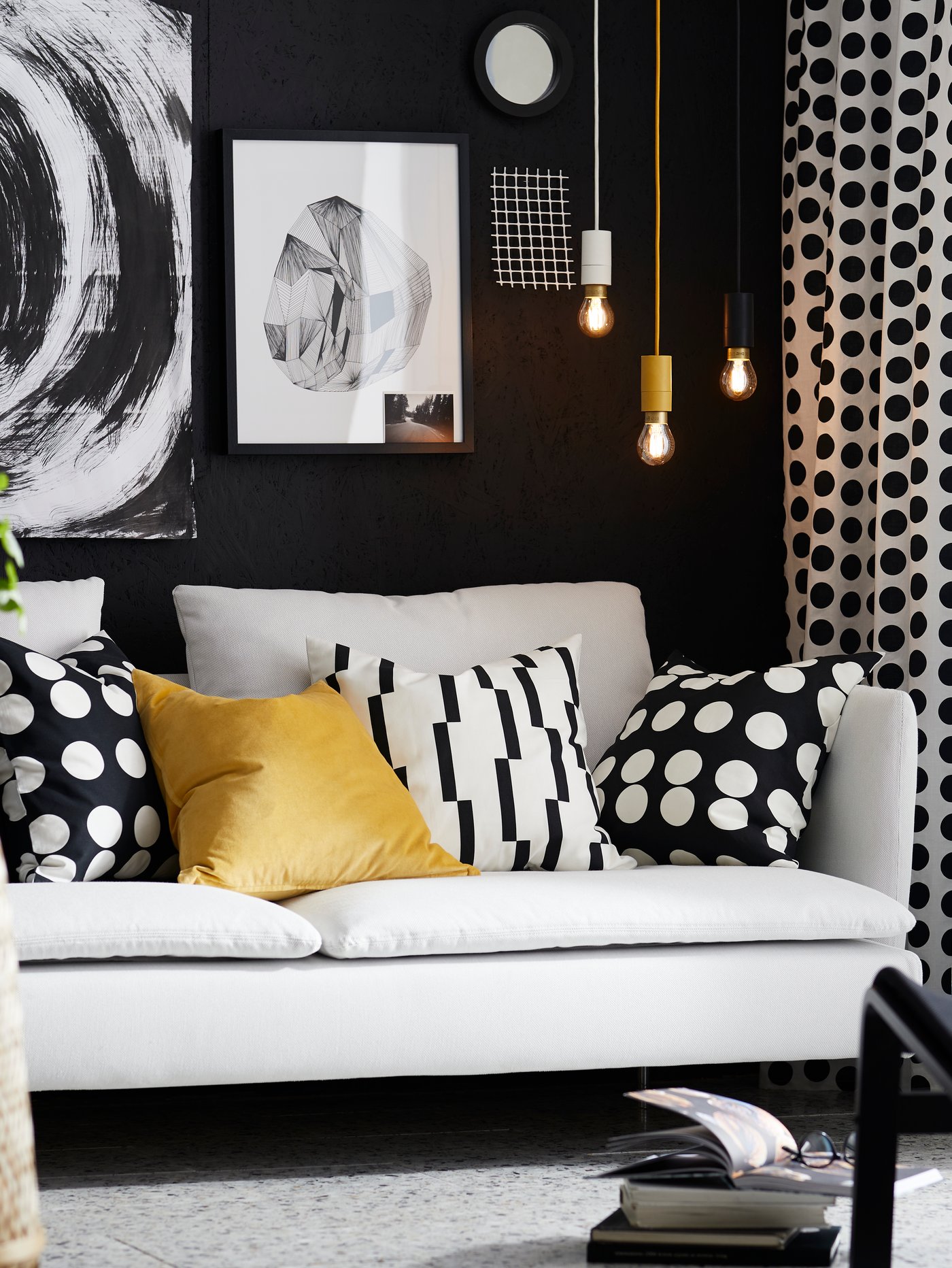 A white/black KINNEN cushion cover in the living room