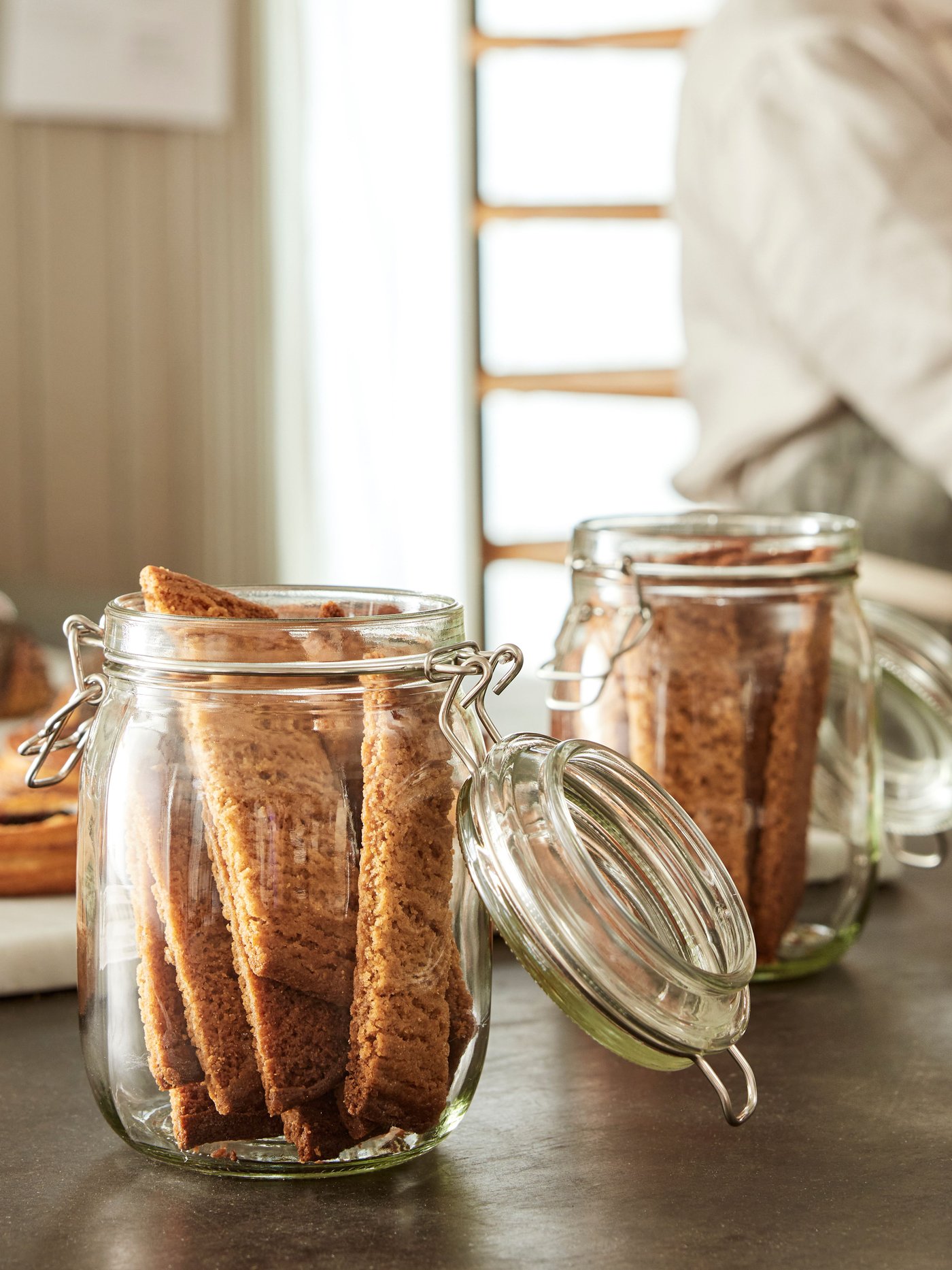 A clear glass KORKEN jar with lid