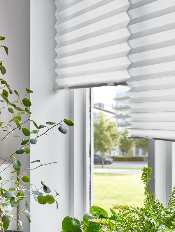 A white SCHOTTIS pleated blind in the home office