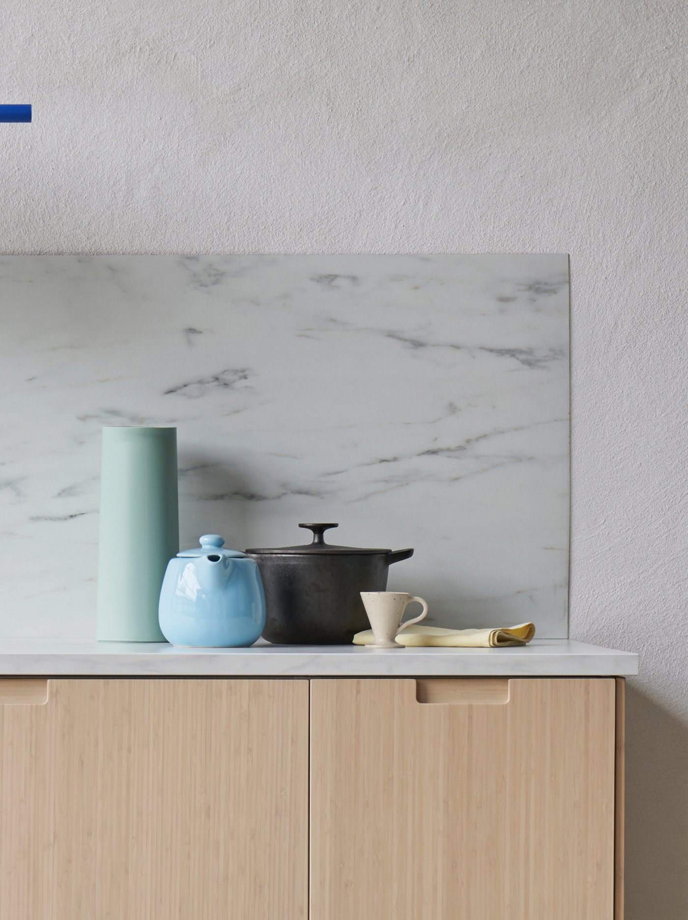 Wooden kitchen with blue teapot