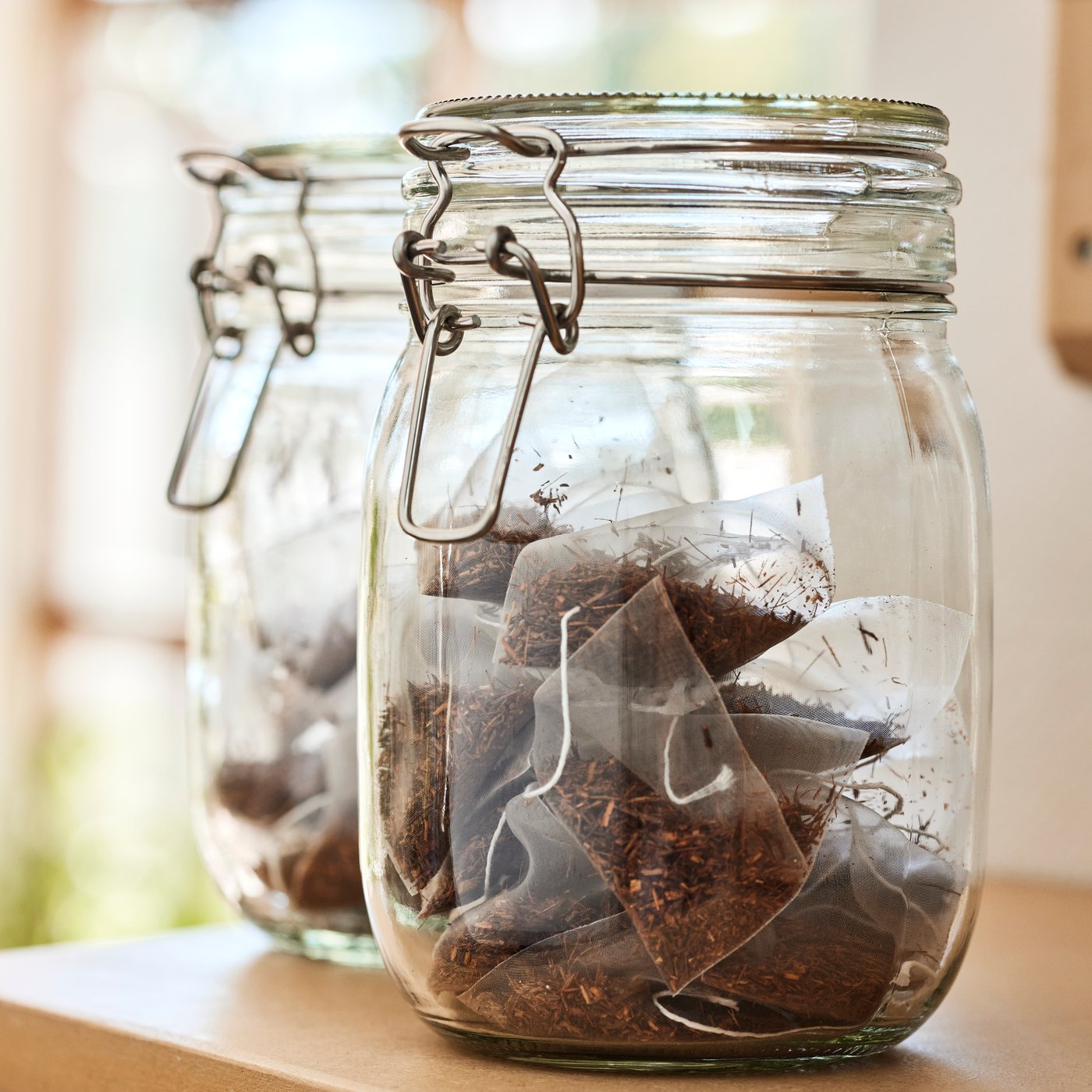 A clear glass KORKEN jar with lid