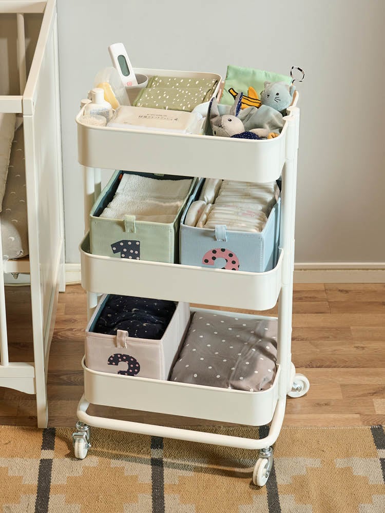 A white RÅSKOG trolley in the childrens room