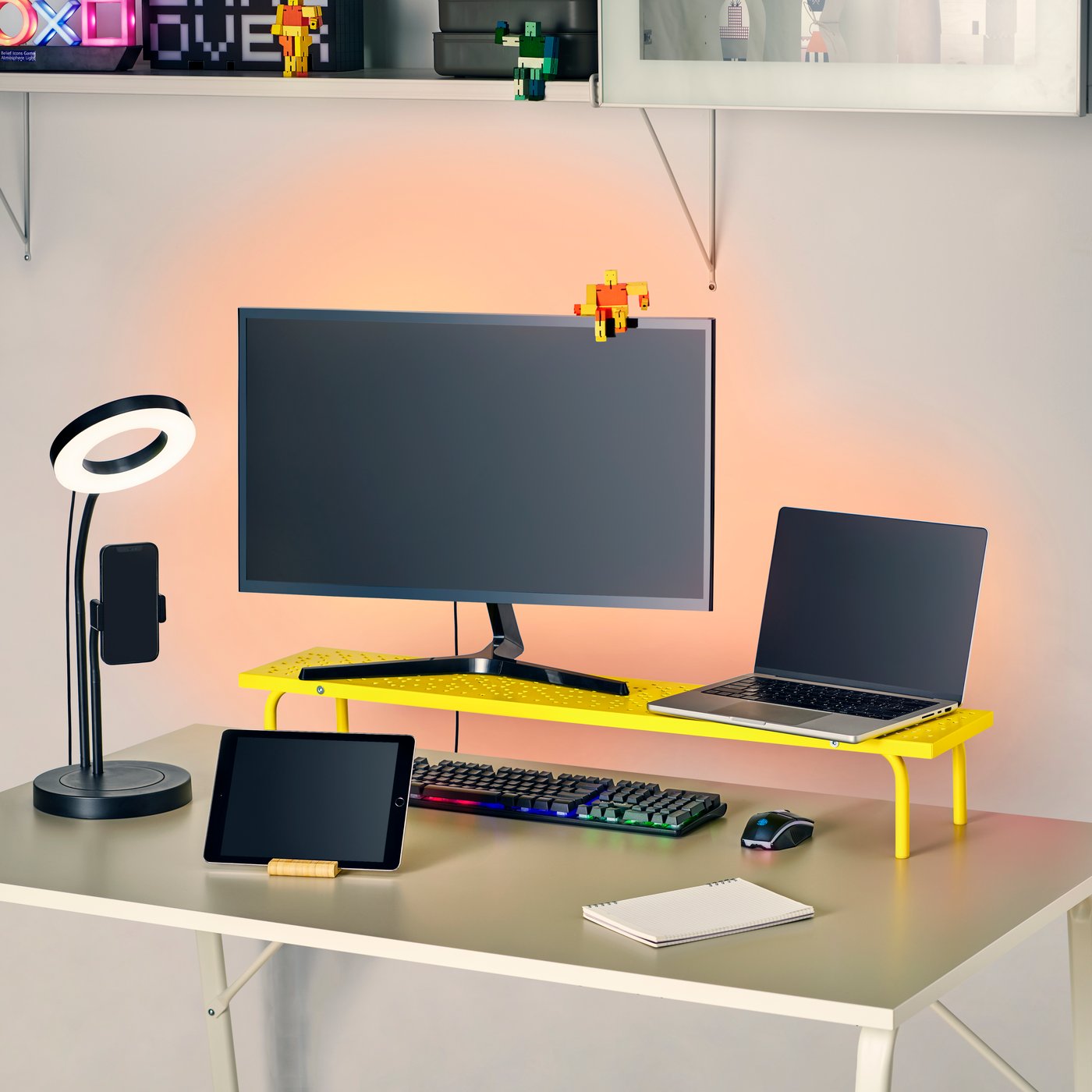 A bright yellow LÅNESPELARE monitor stand