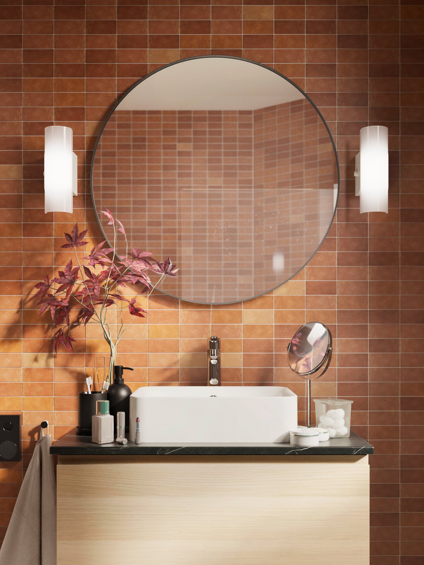 Two HAVSDUN wall lamps next to a round black LINDBYN mirror in the bathroom.