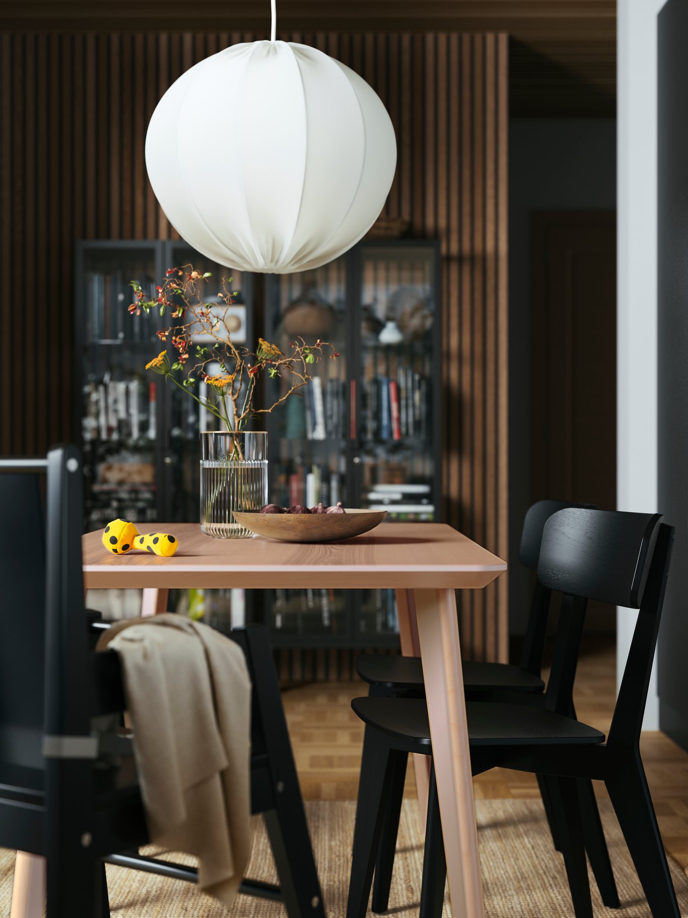 A white REGNSKUR pendant lamp in the dining room