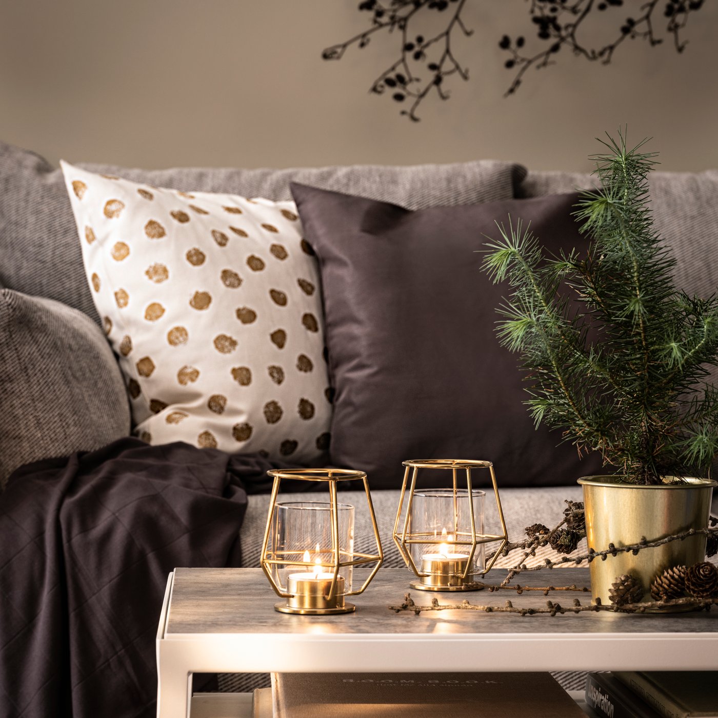 A grey ULLKAKTUS cushion in the living room