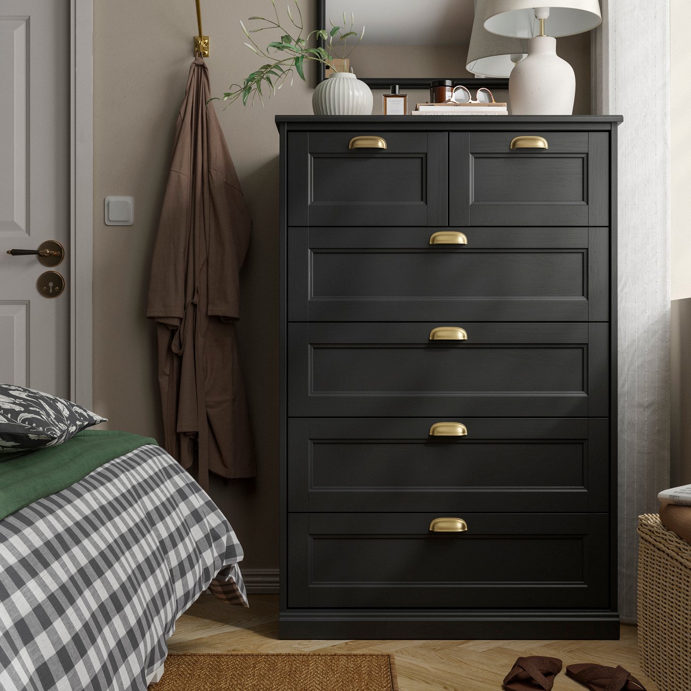 A black oak effect FÅGELFJÄLLET chest of 6 drawers