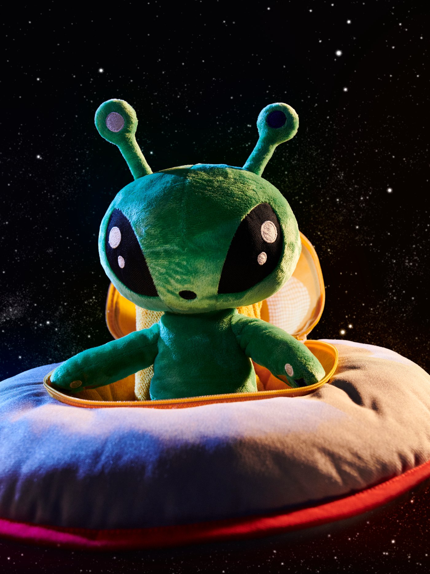 An alien/green AFTONSPARV soft toy
