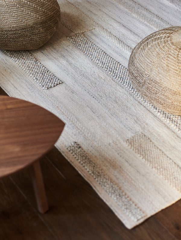 A beige SANDARED pouffe