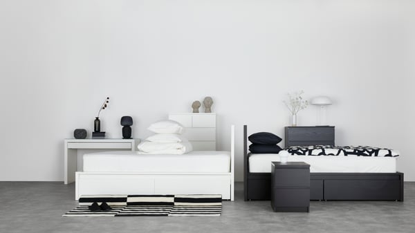A black-brown MALM chest of 2 drawers