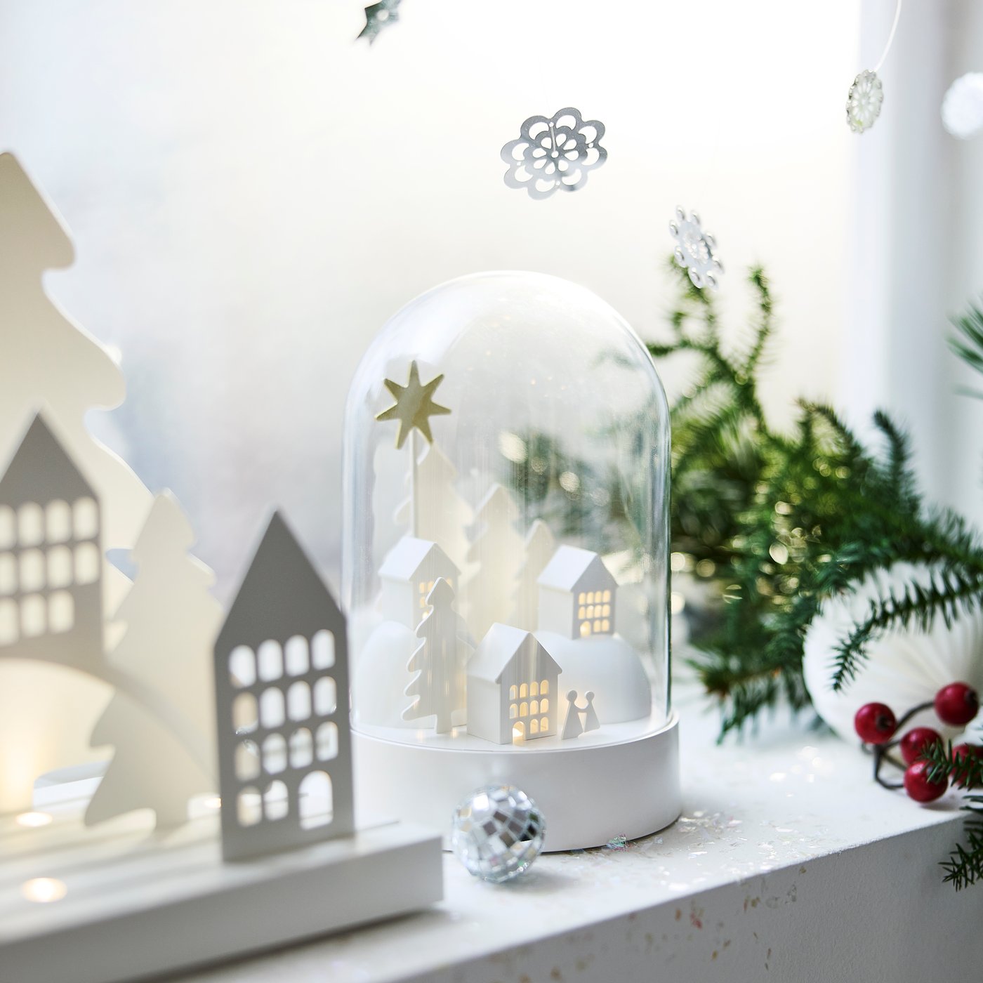 A battery-operated dome/village white STRÅLA LED table decoration