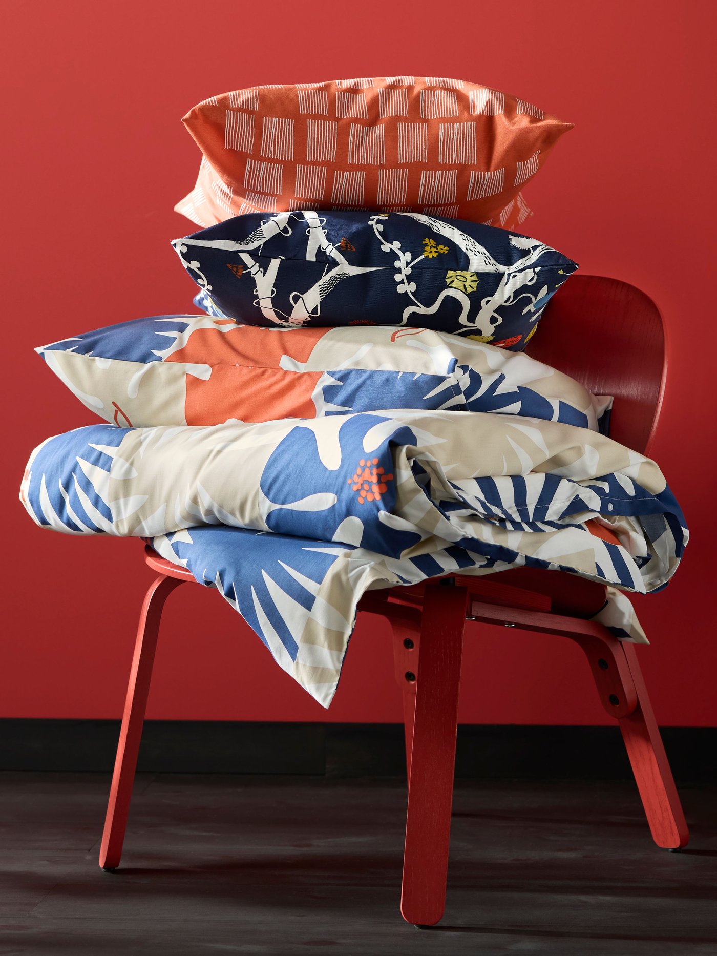 An orange PALPLJUNGMAL cushion cover in the NA