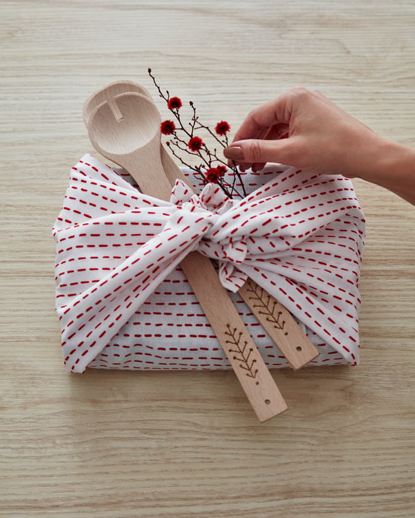A patterned white/red VINTERFEST tea towel in the kitchen