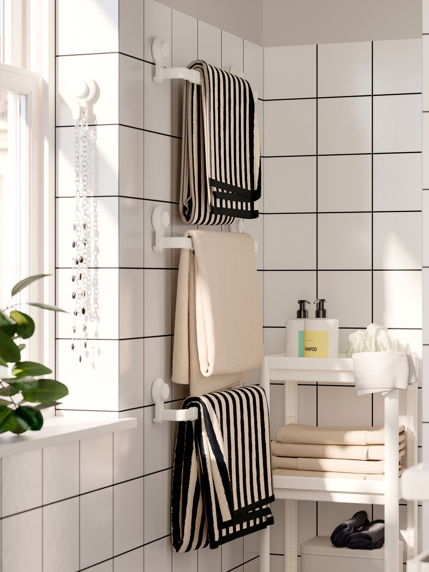 A white TISKEN hook with suction cup in the bathroom