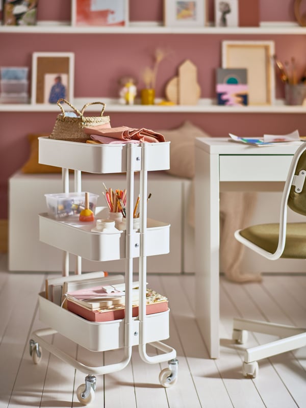 A white RÅSKOG trolley in the childrens room