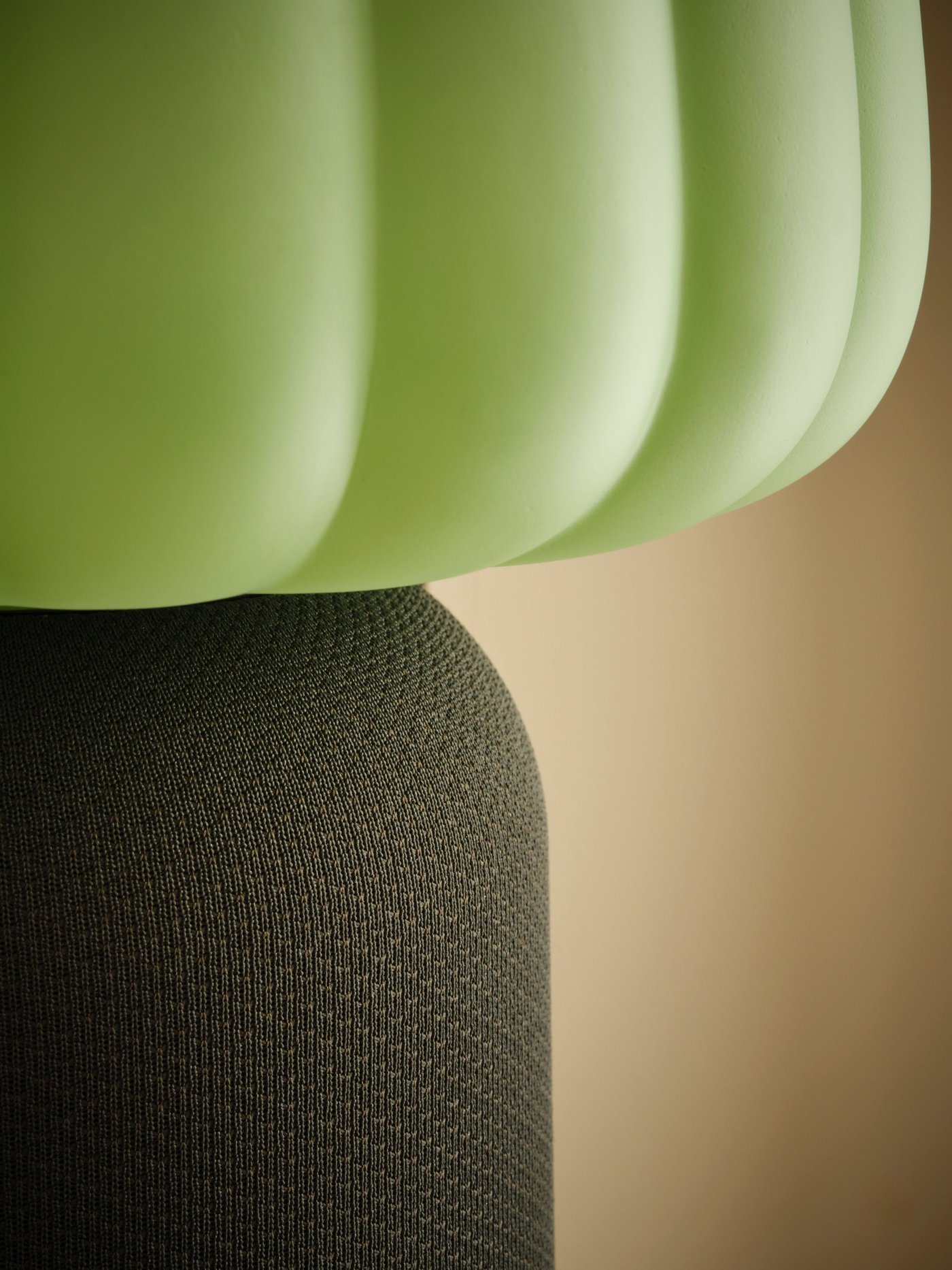 A dark green KULGLASS Bluetooth speaker lamp