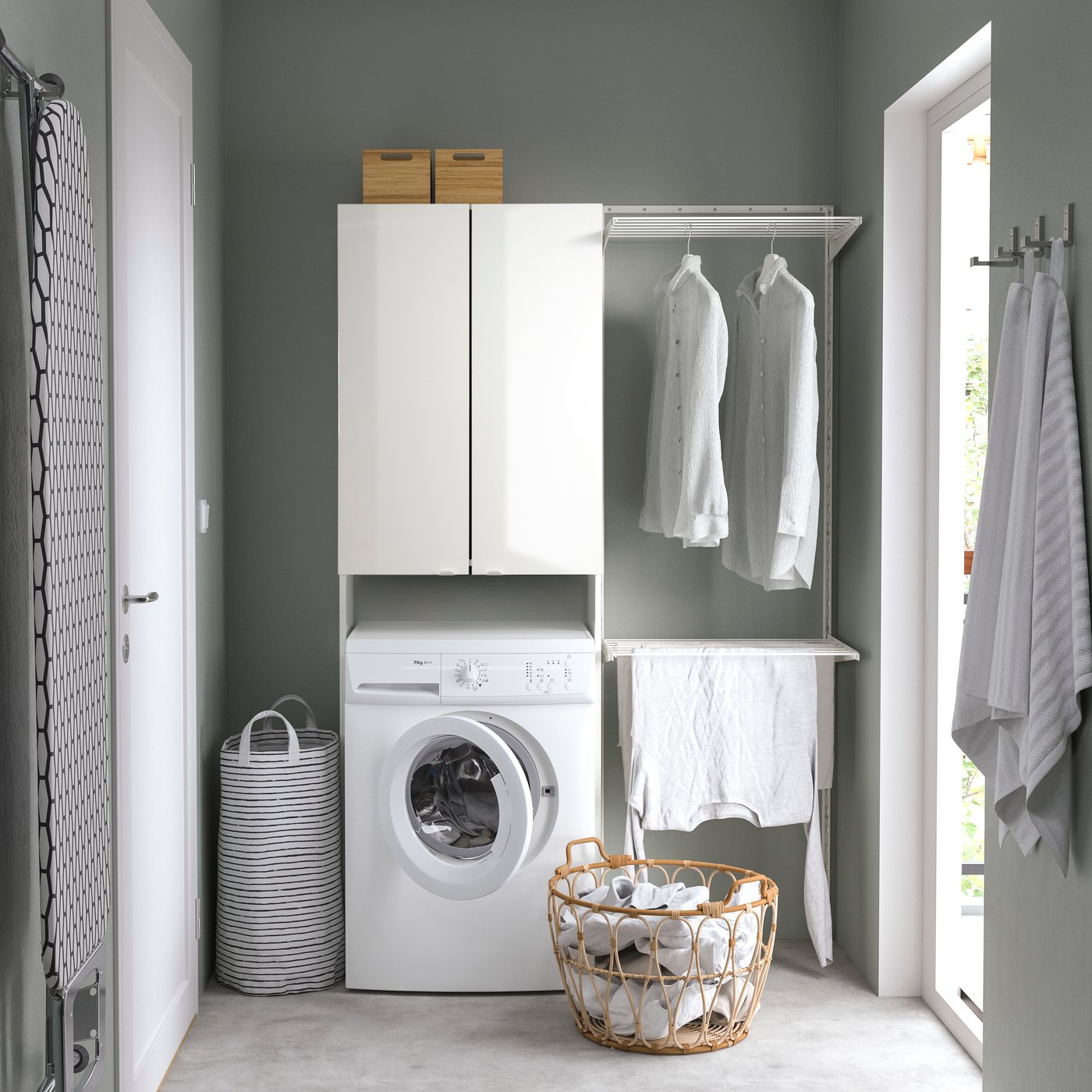 A high-gloss/white FISKÅN cabinet for washing machine
