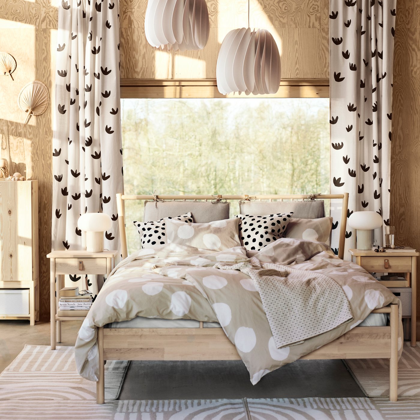 A beige/black NÄCKROSMOTT curtains, 1 pair