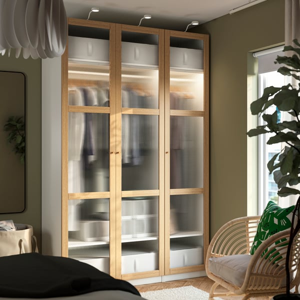 A white/oak veneer glass PAX wardrobe combination