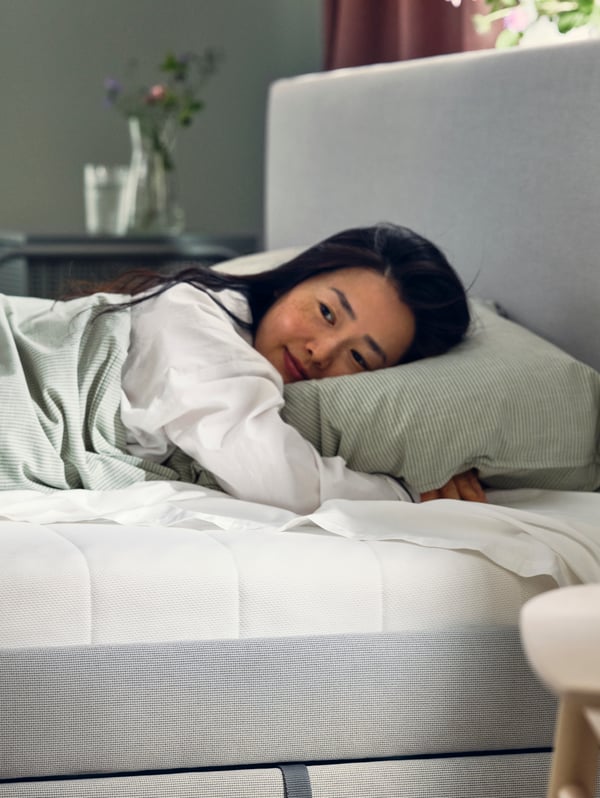 A medium firm/white ÅFJÄLL foam mattress
