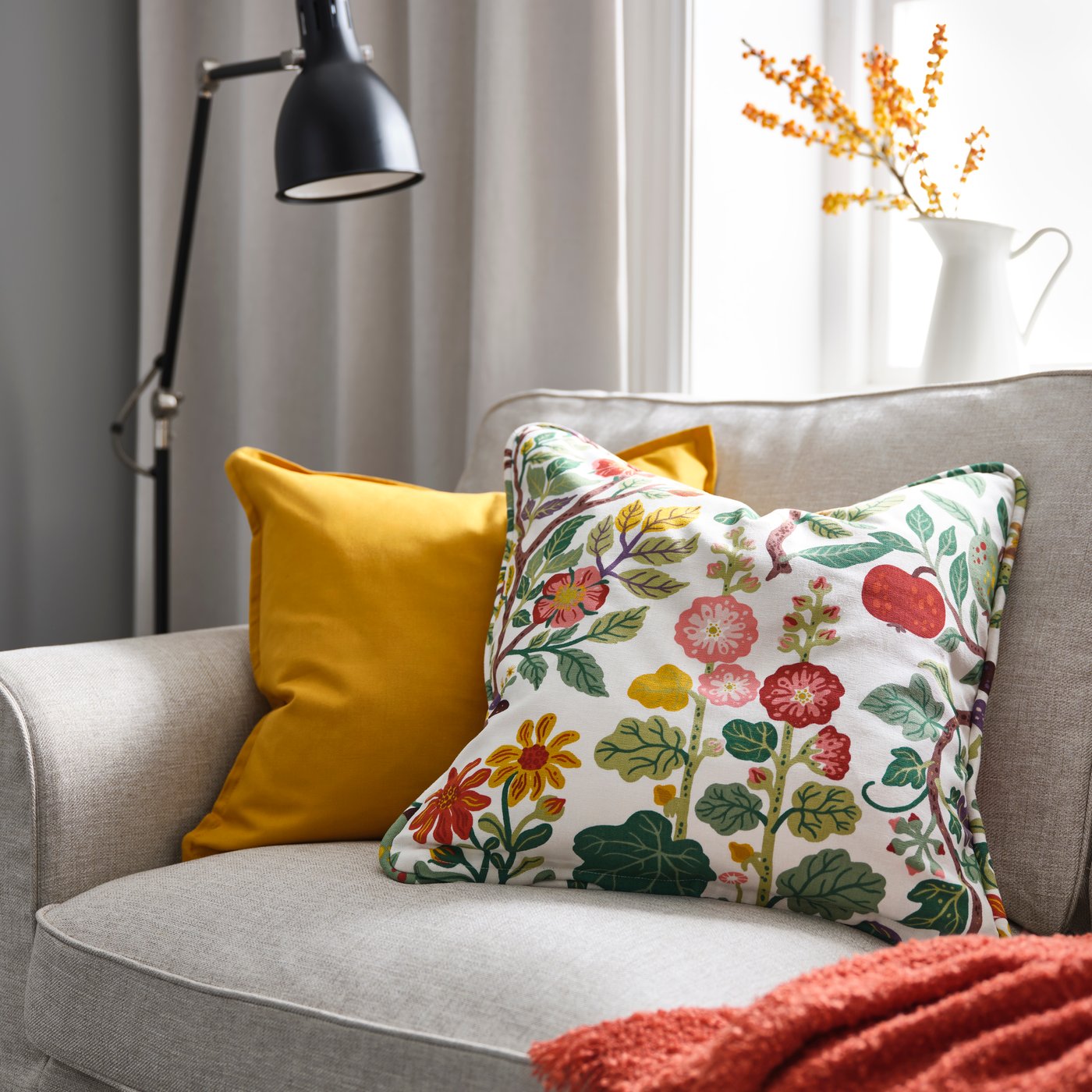An yellow GURLI cushion cover in the living room