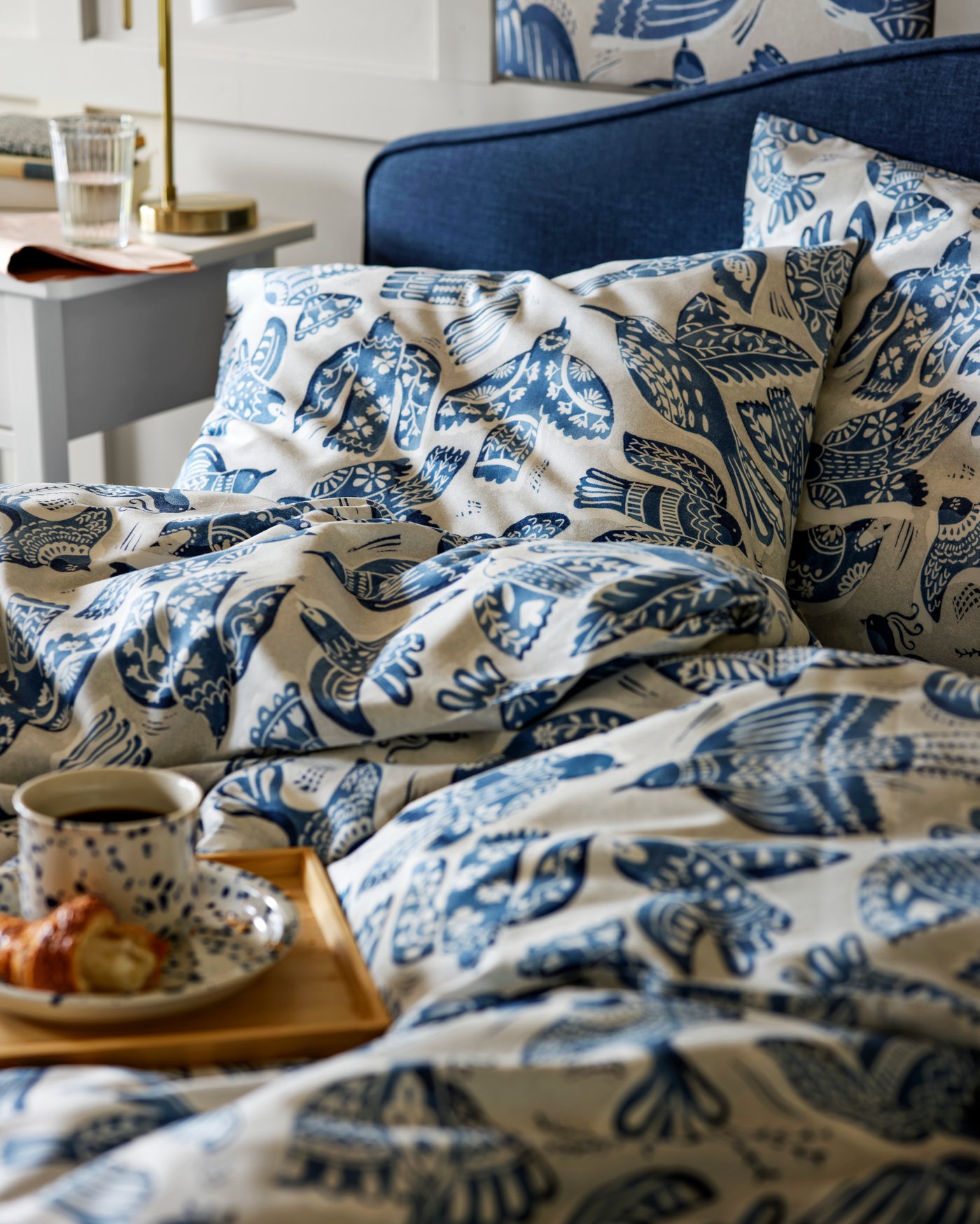 A beige/blue/bird pattern BITTERSÖTA pre-cut fabric in the bedroom