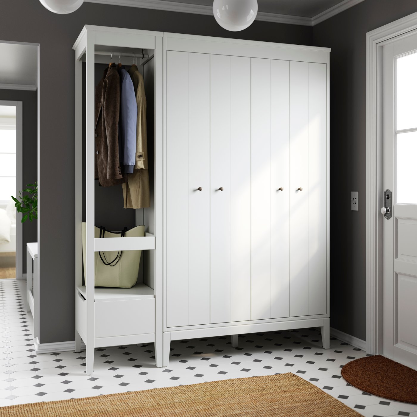 A white IDANÄS wardrobe combination in hallway.