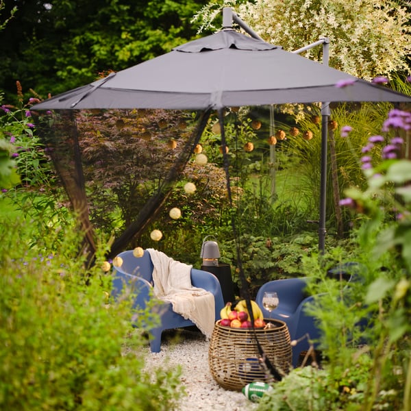 A dark blue SKARPÖ armchair, outdoor outside