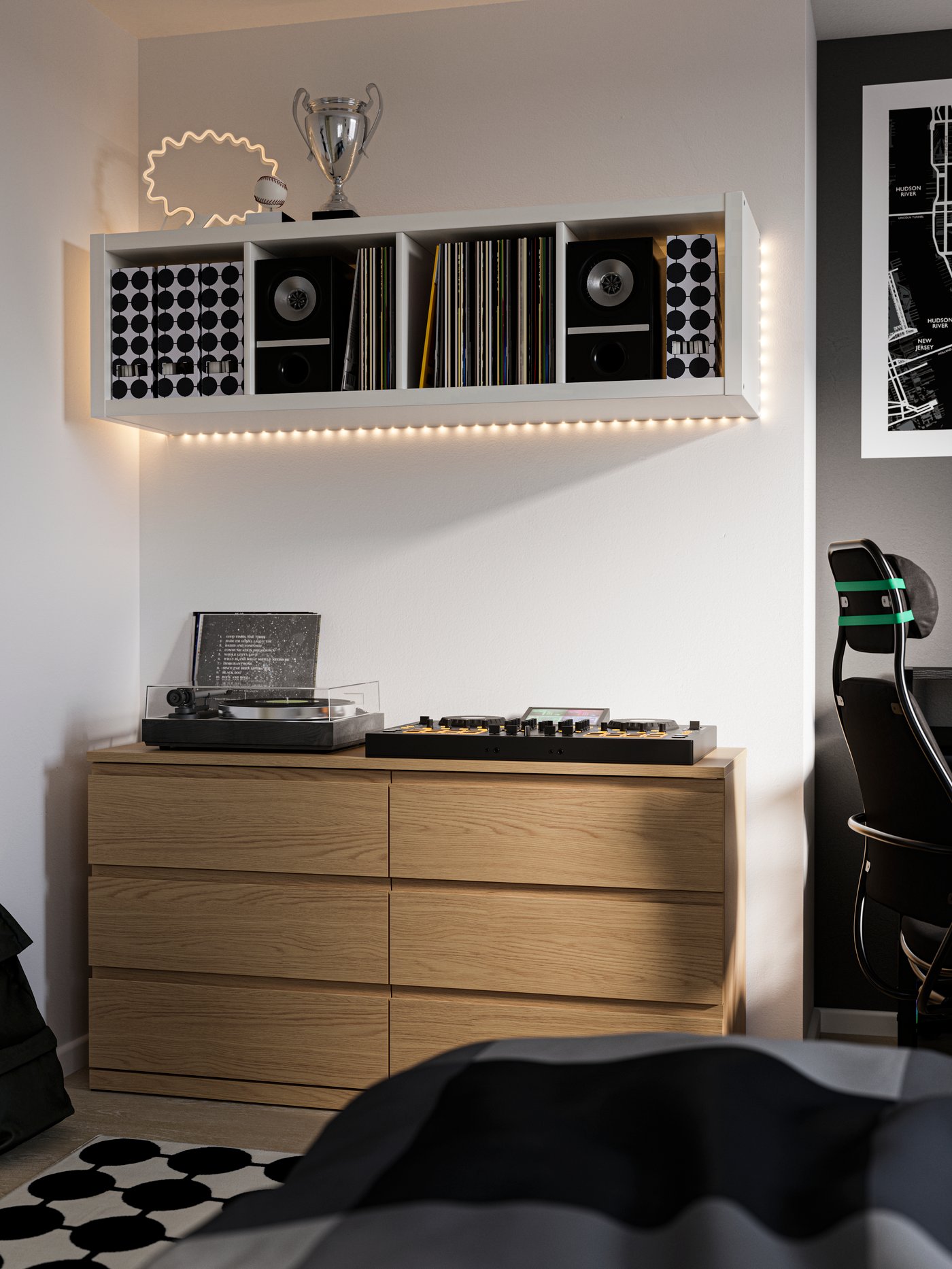MALM chest of drawers in light oak with record players on top of it. White KALLAX shelving unit on the wall above.