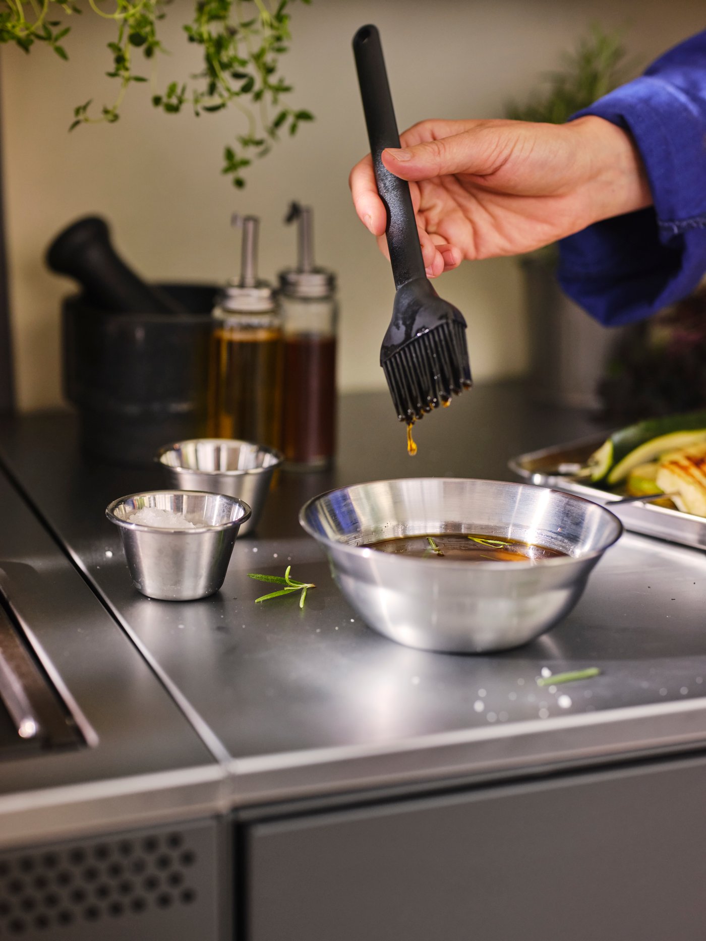 A silicone GRILLTIDER barbecue brush