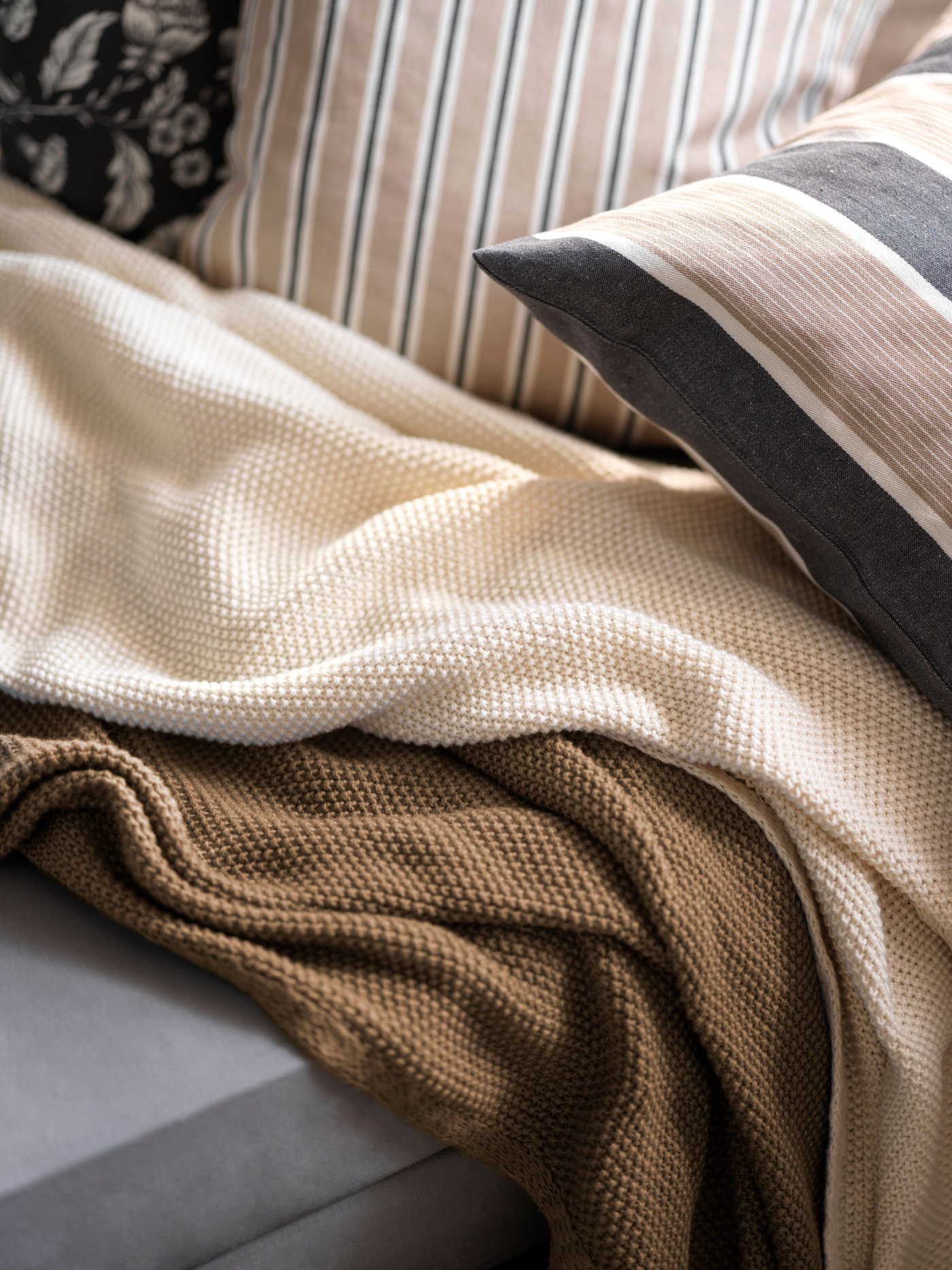 A beige white/stripe pattern KORALLBUSKE cushion cover