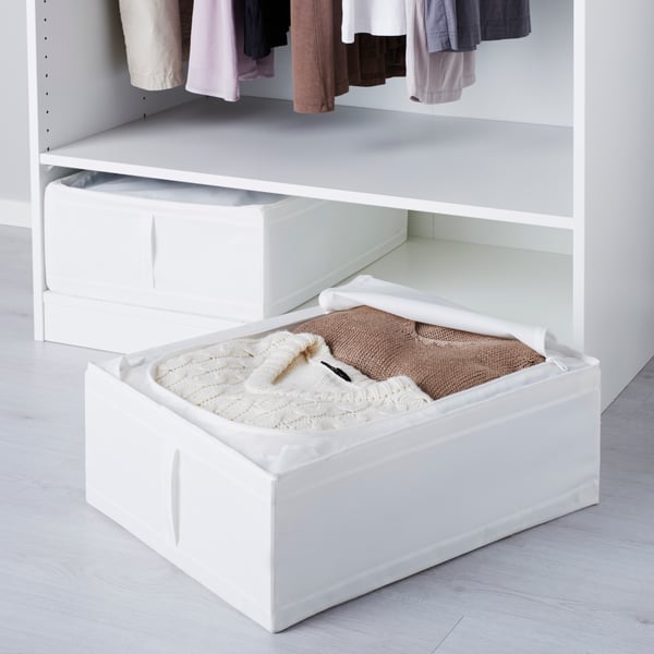 A white SKUBB storage case in the bedroom