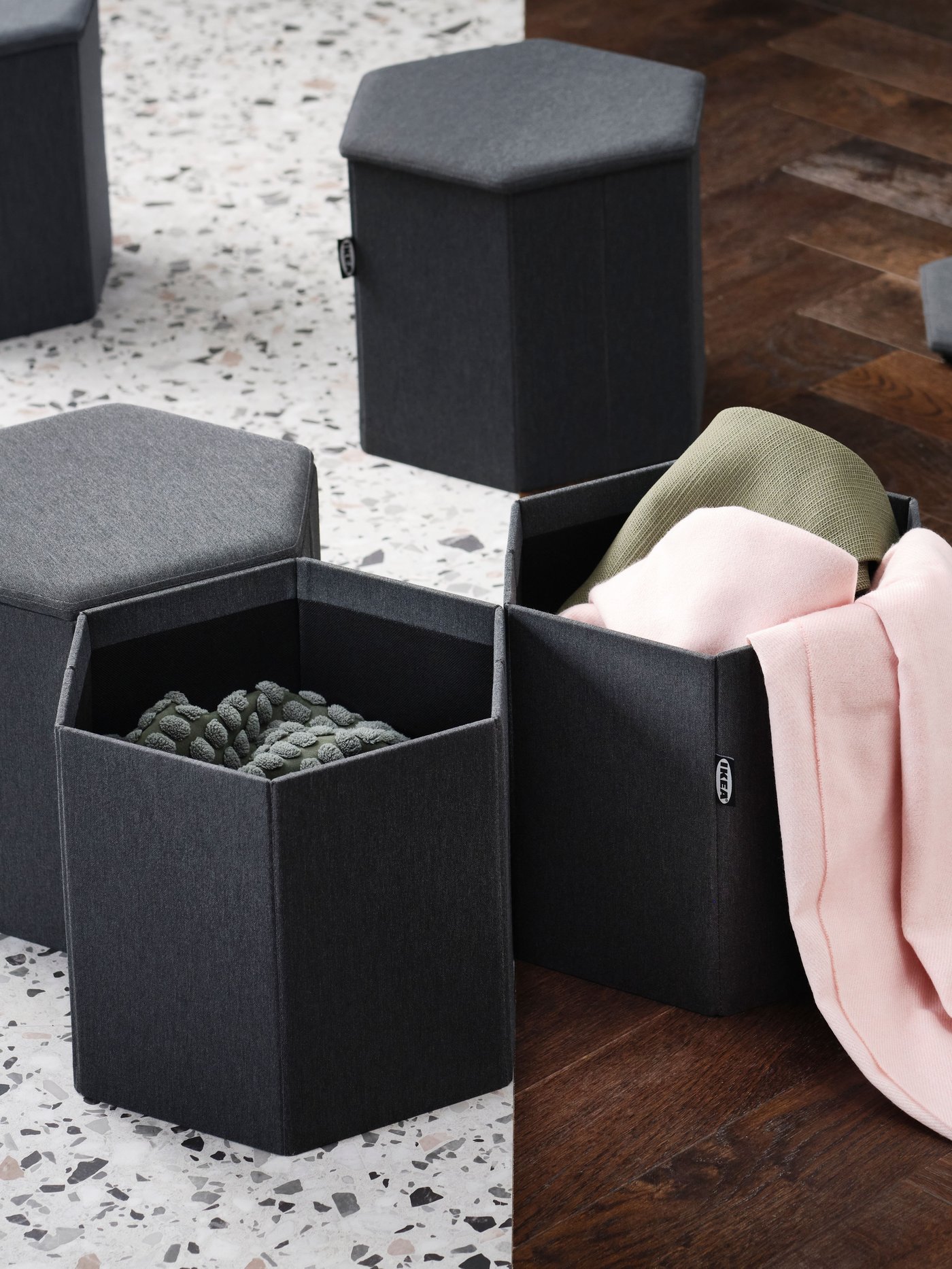 A Knisa dark grey KJUGE pouffe with storage