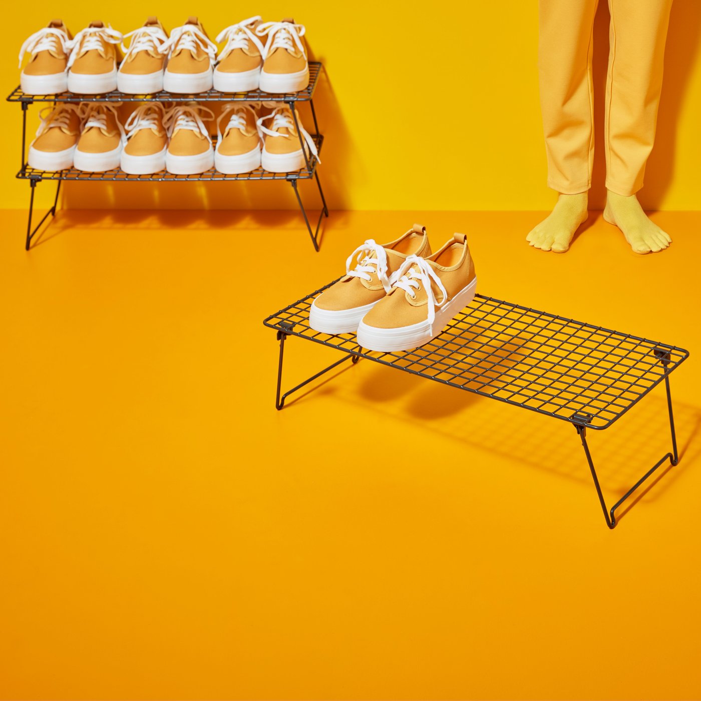 A grey GREJIG shoe rack in the hallway