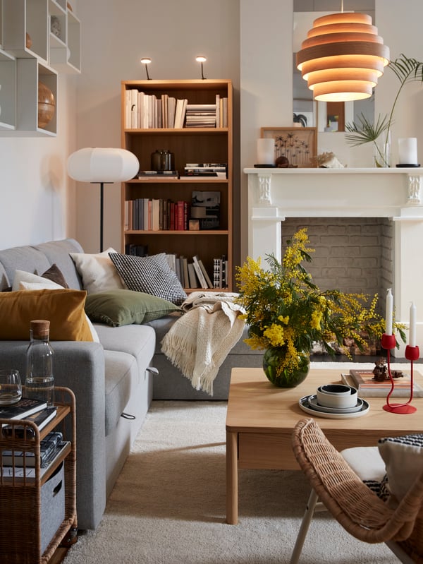 A white JUBLA unscented household candle in the living room