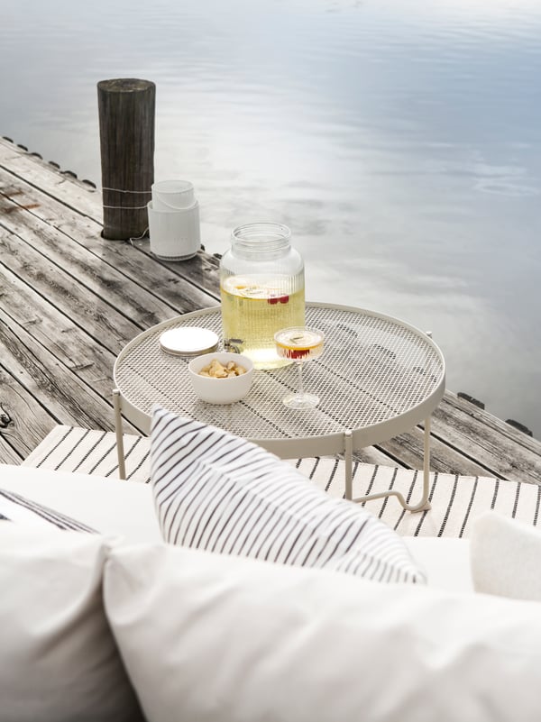 A beige KROKHOLMEN coffee table, outdoor