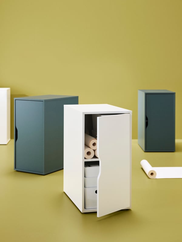 ALEX Storage units in white and grey-turquoise standing on a floor