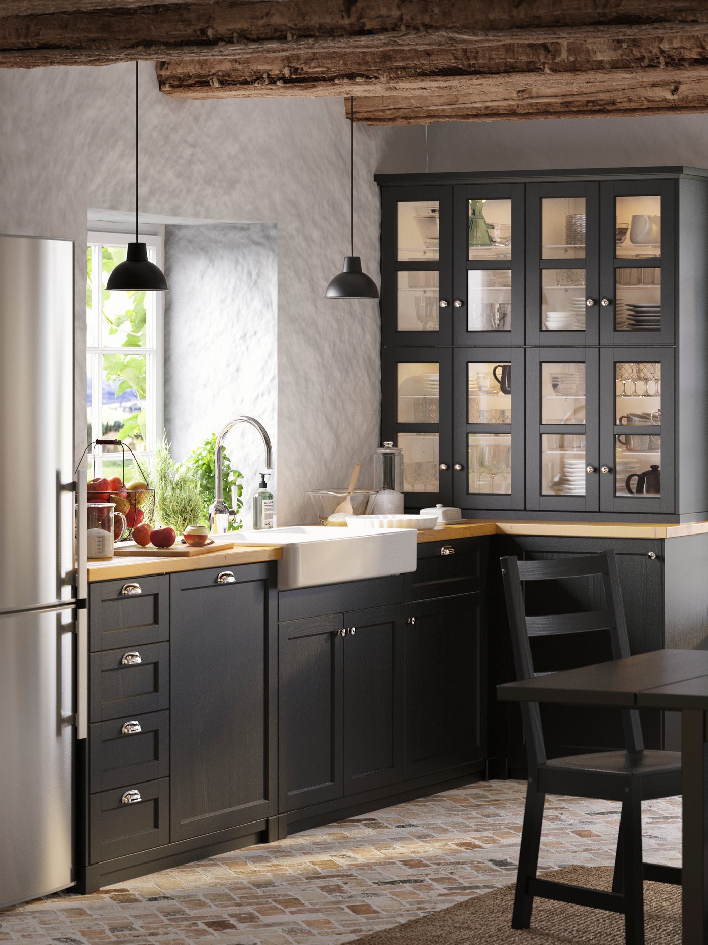 A black NORDVIKEN extendable table in the kitchen