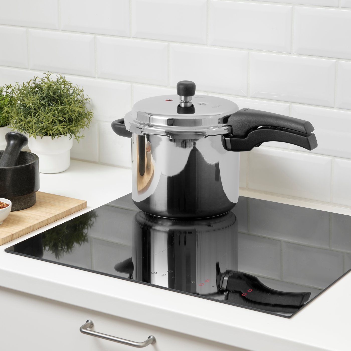 A stainless steel BANDGURAMI pressure cooker
