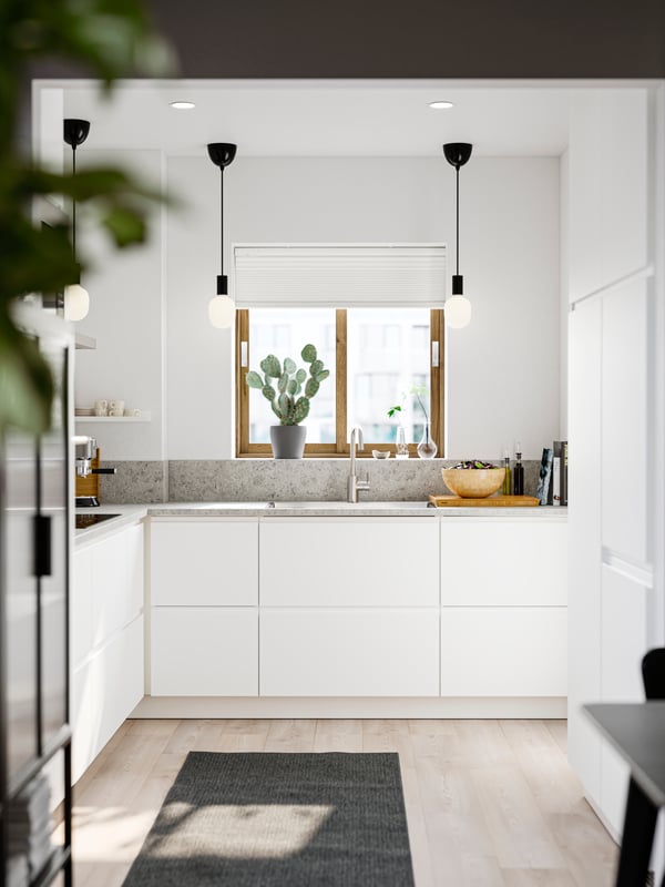 A stainless steel colour ÄLMAREN kitchen mixer tap in the kitchen