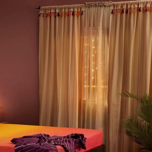 An off-white GOKVÄLLÅ curtain