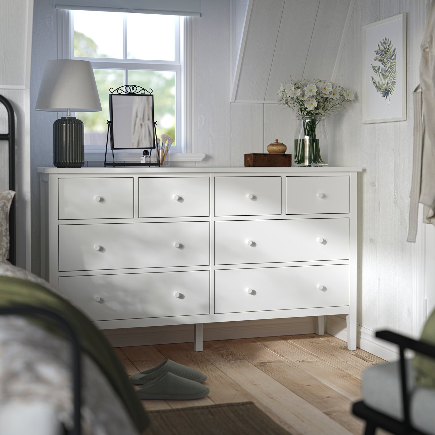 A white GULLABERG chest of 8 drawers in the bedroom