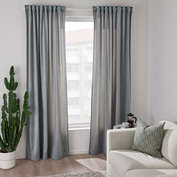 A drawing of a window adorned with short curtains.